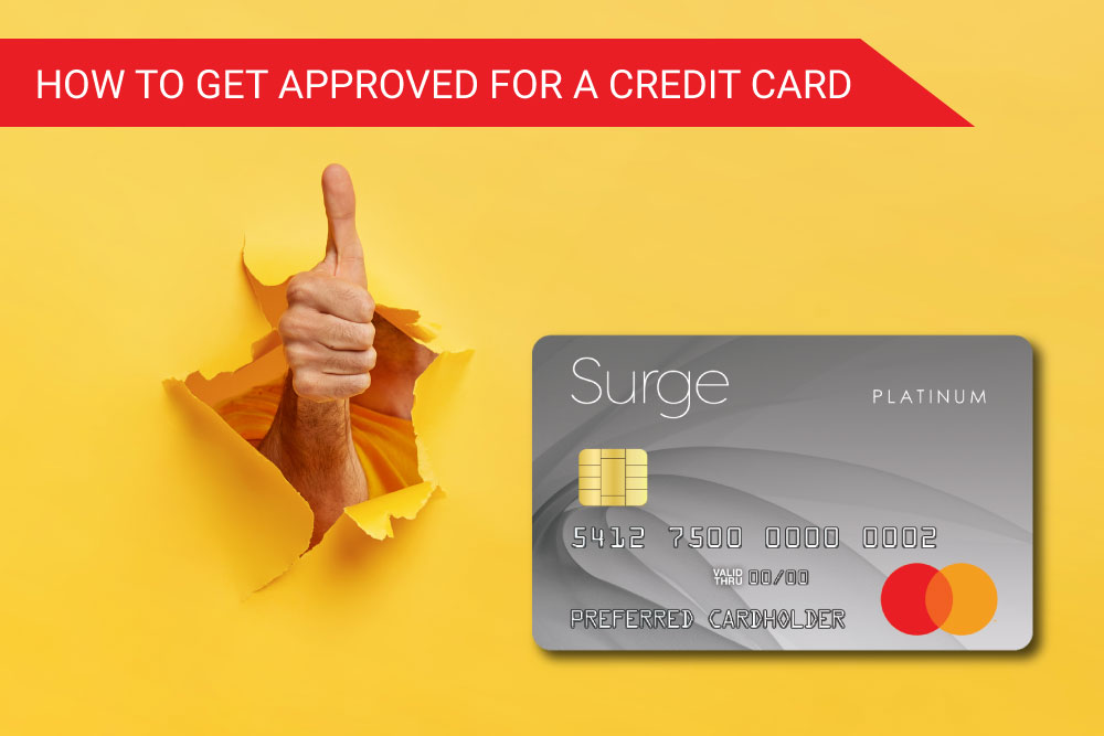 How to get approved for a credit card. A hand gives the thumbs up of approval to a Platinum Surge Mastercard